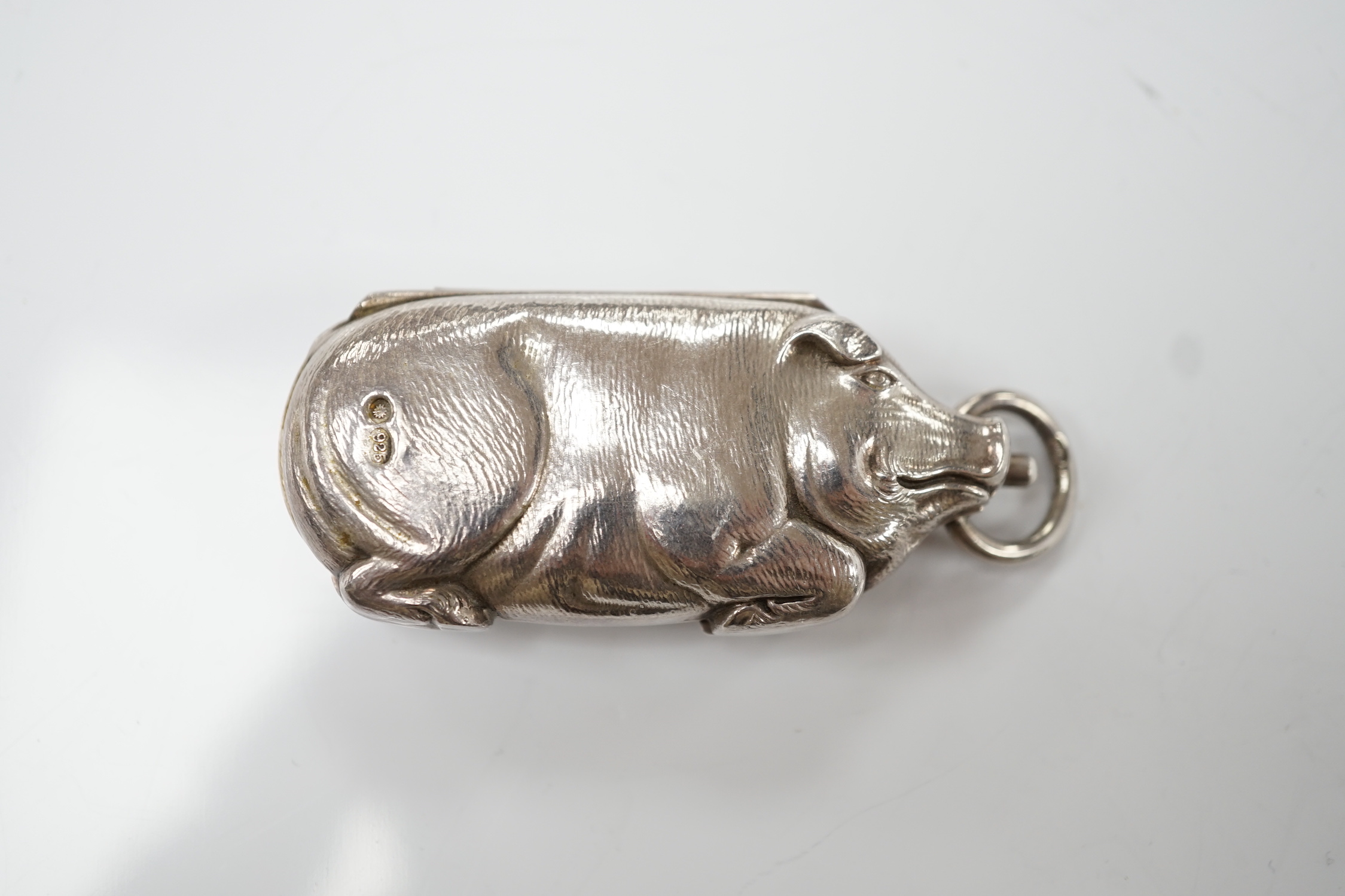 An Edwardian novelty silver sovereign/half sovereign case, modelled as a pig, import marks for Robert Friederich, London, 1905, 63mm.